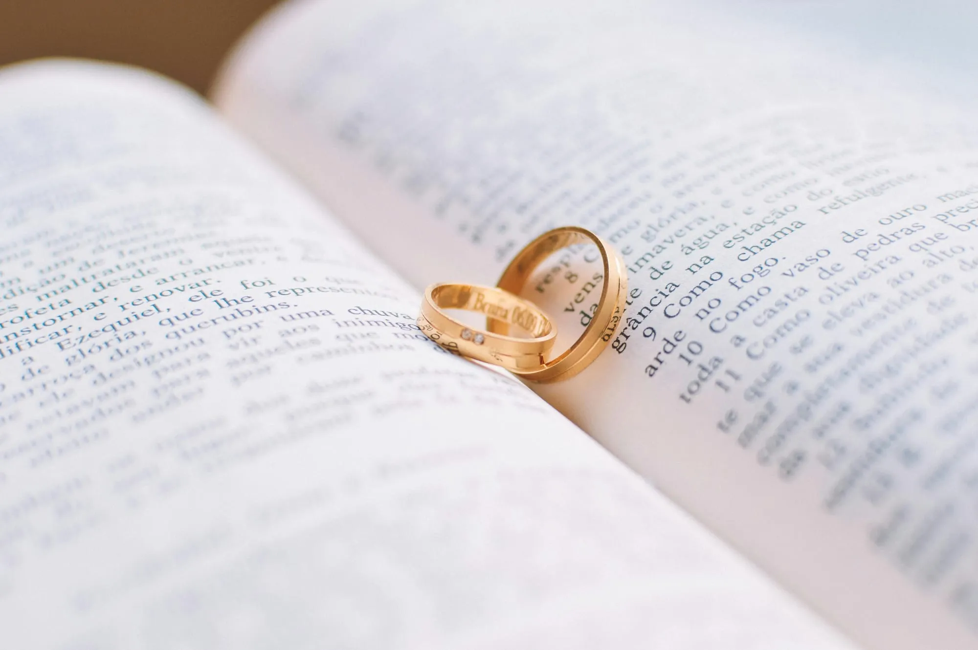 two gold rings on a book